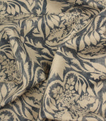 Floral and leaf patterned fabric in beige and navy