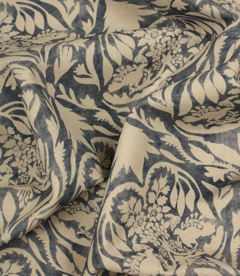 Floral and leaf patterned fabric in beige and navy