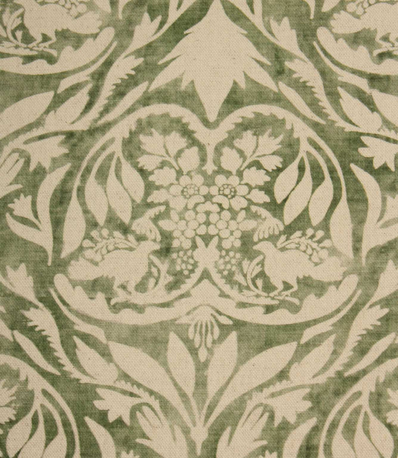 Decorative fabric pattern with floral and leaf design on a green background