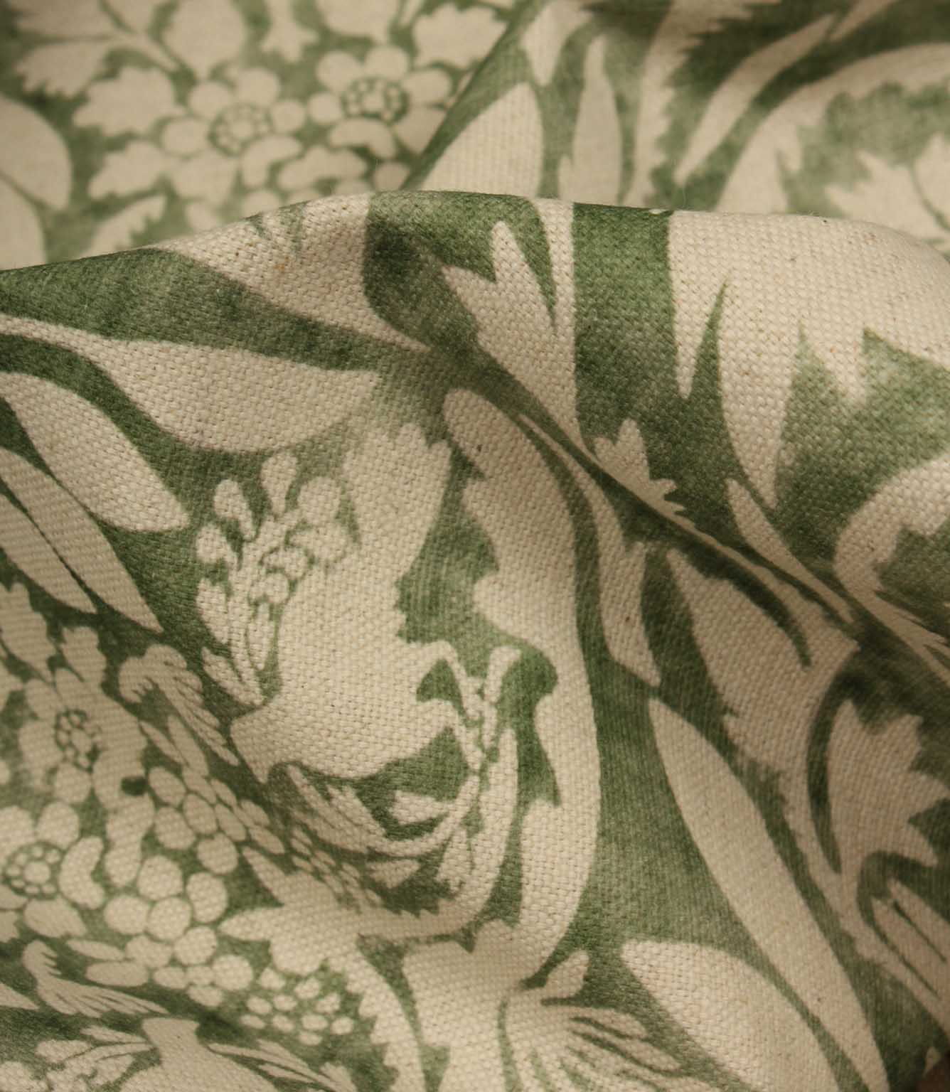 Close-up of green and beige floral patterned fabric