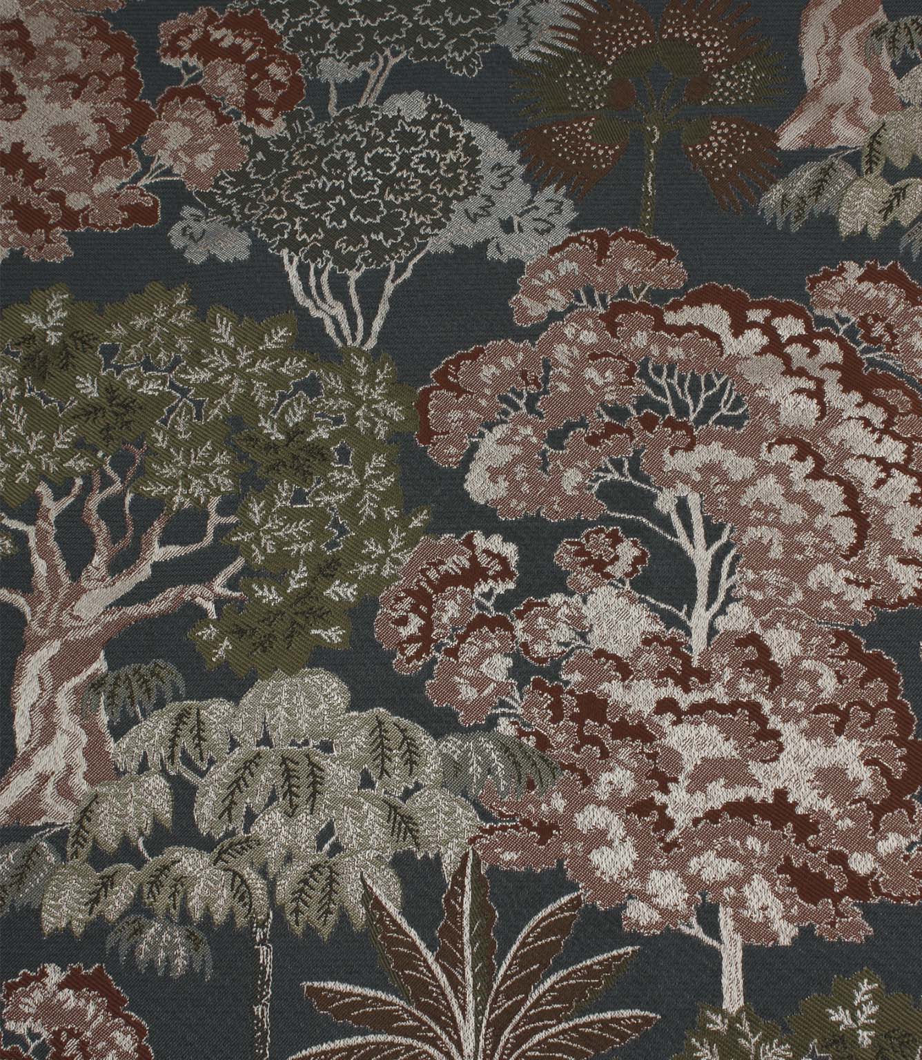 Woodlands Navy fabric featuring an intricate woven woodland scene with stylised trees and foliage in rust, olive green and cream on a deep navy background.
