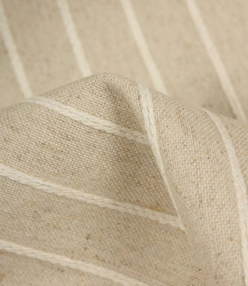 Detailed close-up of Wooton Wide embroidered stripe upholstery fabric with textured woven construction.