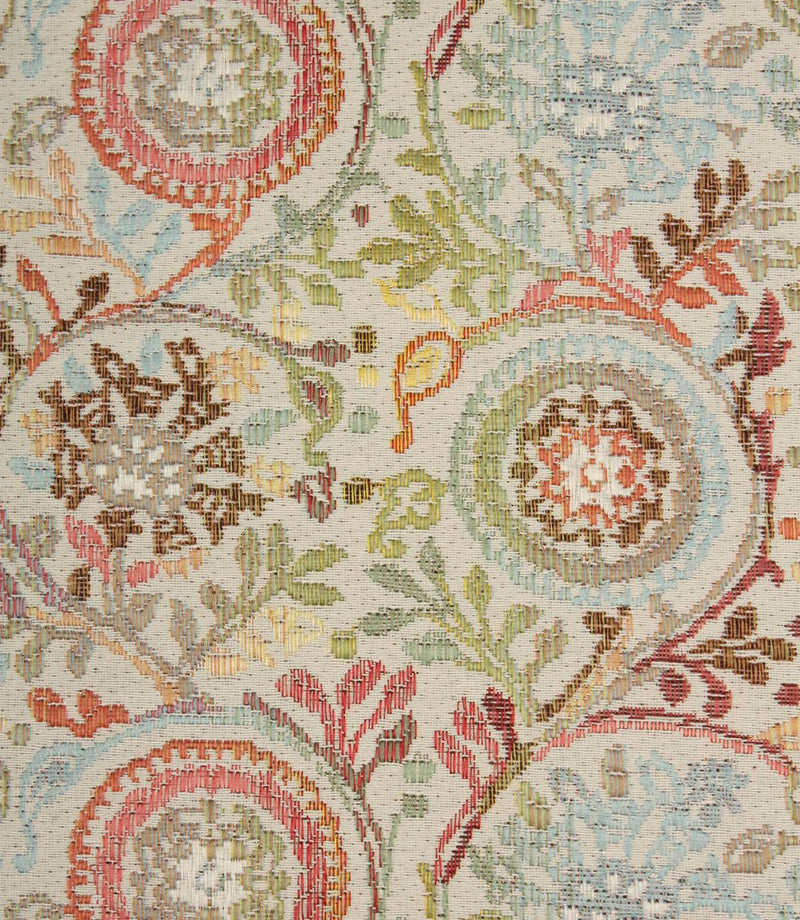 Close-up of Wychwood Jasmine woven floral fabric showing intricate botanical motifs in pastel blue, green, coral and earthy brown shades.