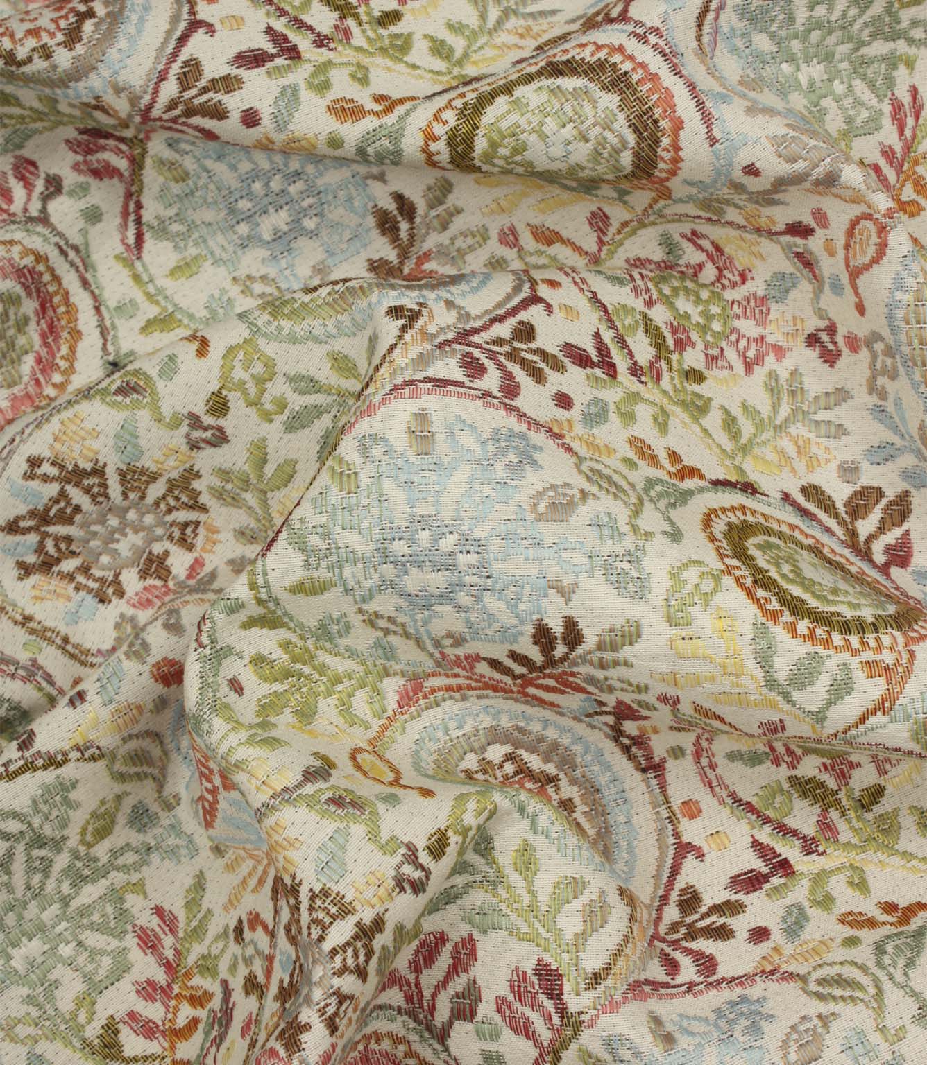 Draped Wychwood Jasmine fabric revealing the texture, movement and multicoloured botanical design on a natural-look background.