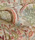 Detailed close-up of Wychwood Jasmine woven upholstery fabric highlighting the intricate floral weave in blue, green, coral, brown and cream tones.