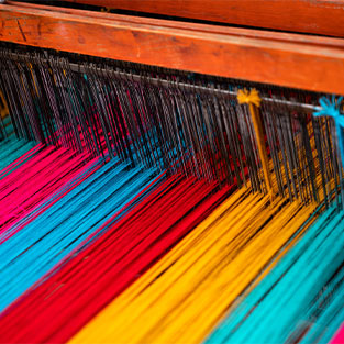 How is woven fabric made?