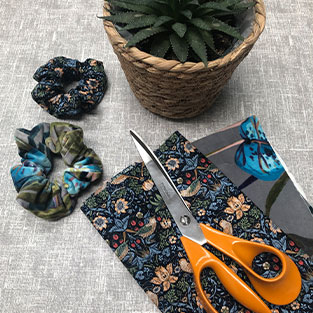 Watch our video on How to Make a DIY Fabric Scrunchie Watch our video on How to Make a DIY Fabric Scrunchie
